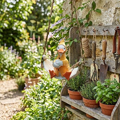 Statue de jardin jardin canard qui ce balance 