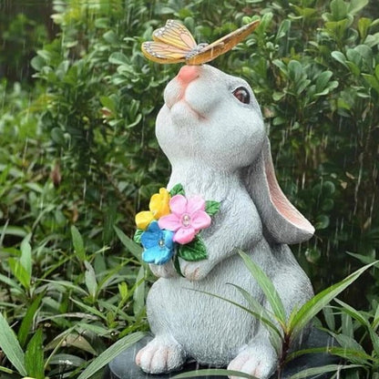 Statue de jardin lapin avec bouquet