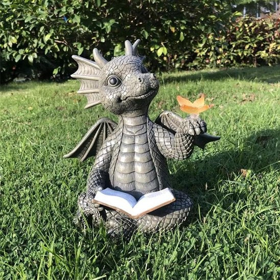 Statue jardin petit dragon papillon à la main