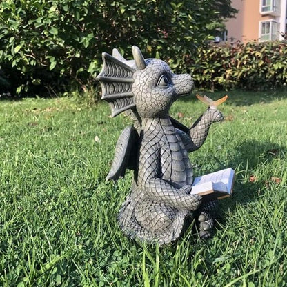 Statue jardin petit dragon qui lit un livre